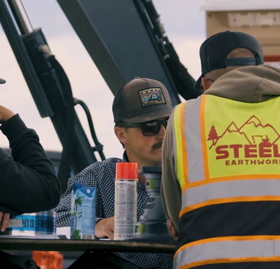 Steele Earthworks crew staging fittings and prepping work at a Central Oregon jobsite