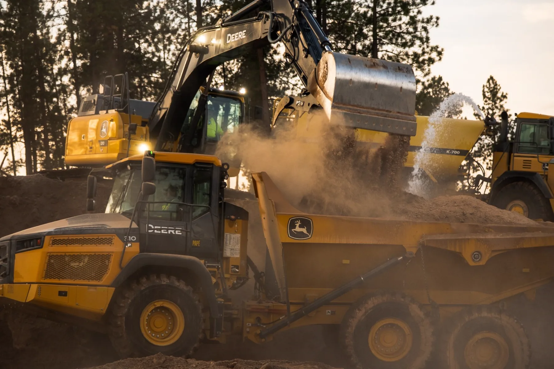 A Steele Earthworks excavator loading a haul truck